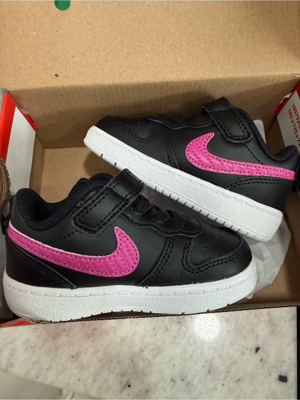 Nike Kids Black Sneakers with Pink Swoosh